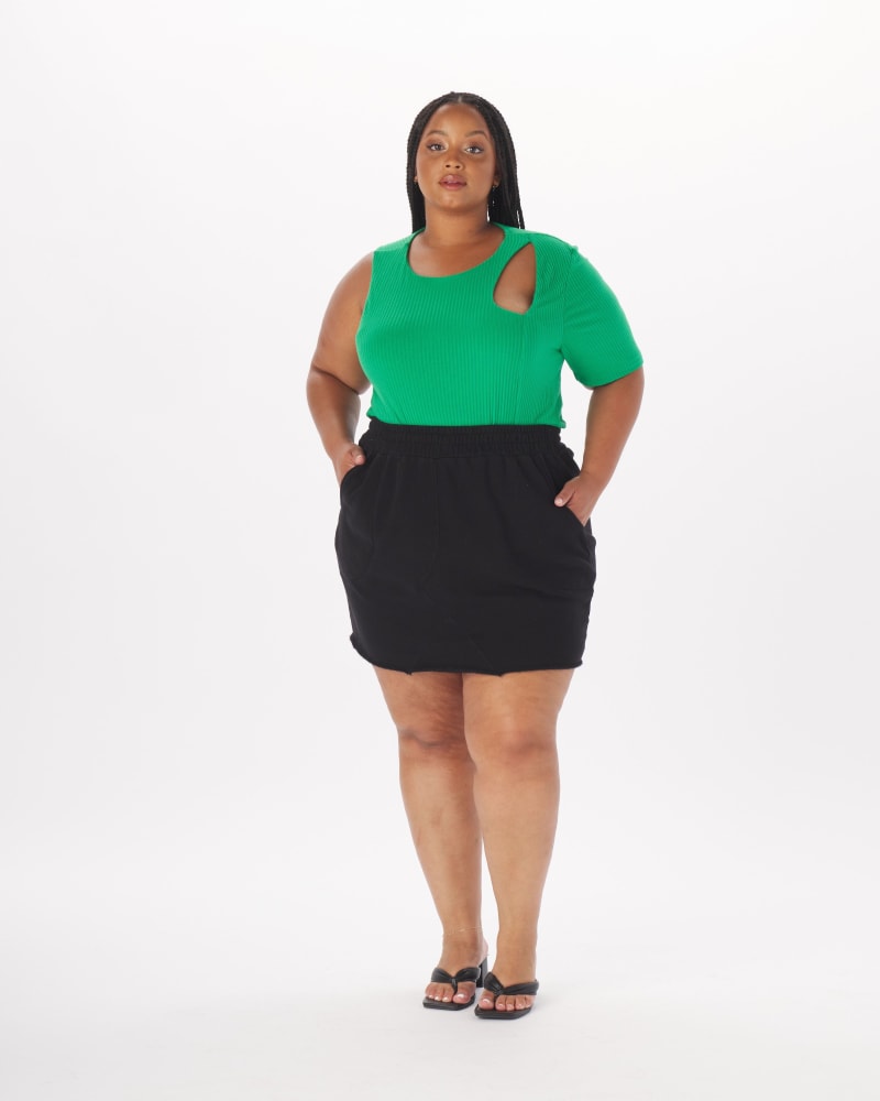Front of a model wearing a size 4X Sammy One-Sleeve Cut-Out Top in Kelly Green in Kelly Green by What Lo Wants. | dia_product_style_image_id:238002